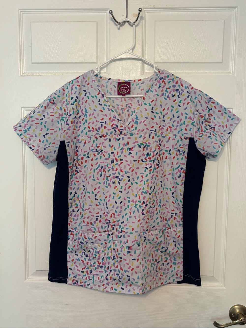 Divine Scrubs JDM White Scrub Top with Multicolor Sprinkle Print and Navy Panels
